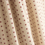 Popelín Estampado Estrellas Grana-Crudo - Ribes y Casals