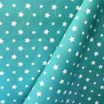 Popelín Algodón Estrellas Fondo Aguamarina - Ribes y Casals