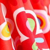 Raso Carnaval Flor Hippie Rojo - Ribes y Casals